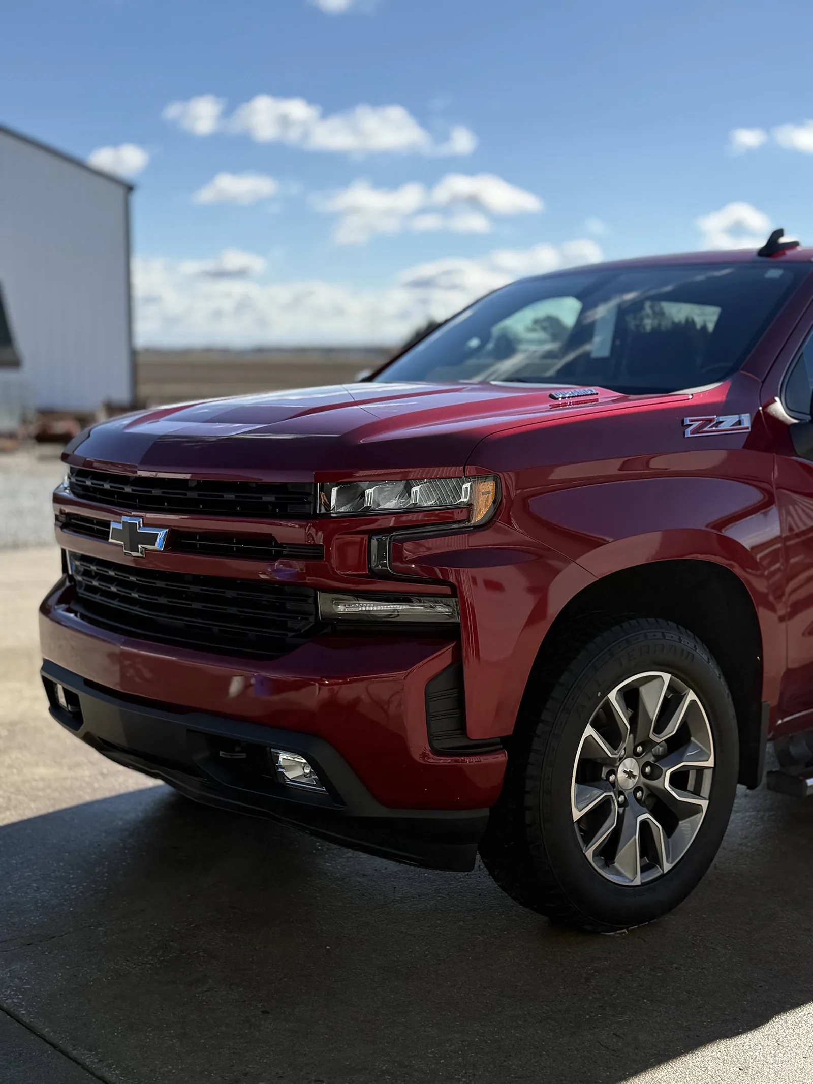 Red Chevy Silverado Z71 pickup with glossy paint after detailing