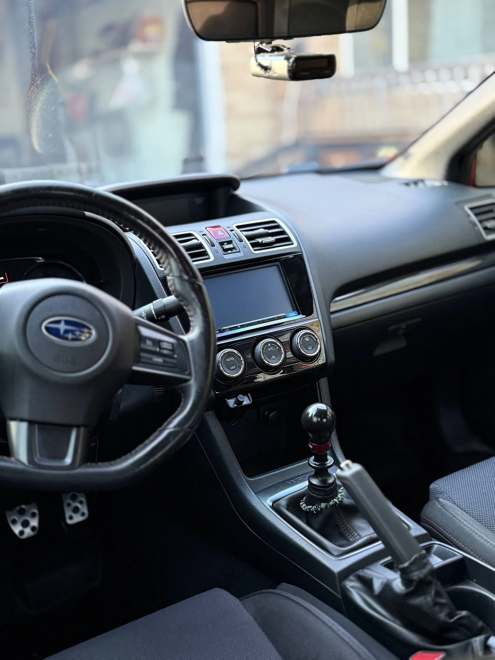 Subaru WRX dashboard, steering wheel and center console after interior detailing
