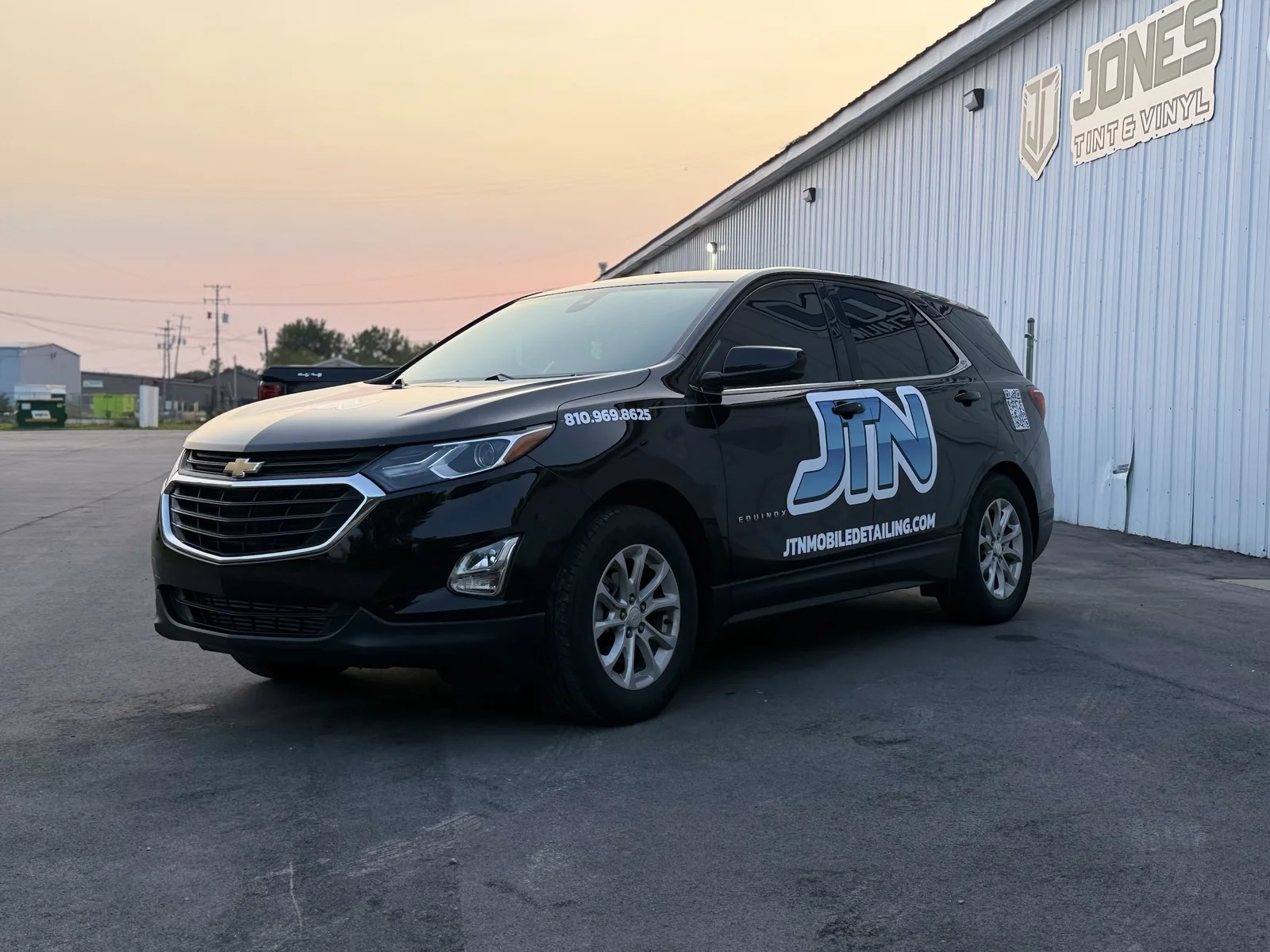 JTN Mobile Detailing branded black Chevy Equinox mobile detailing unit at sunset