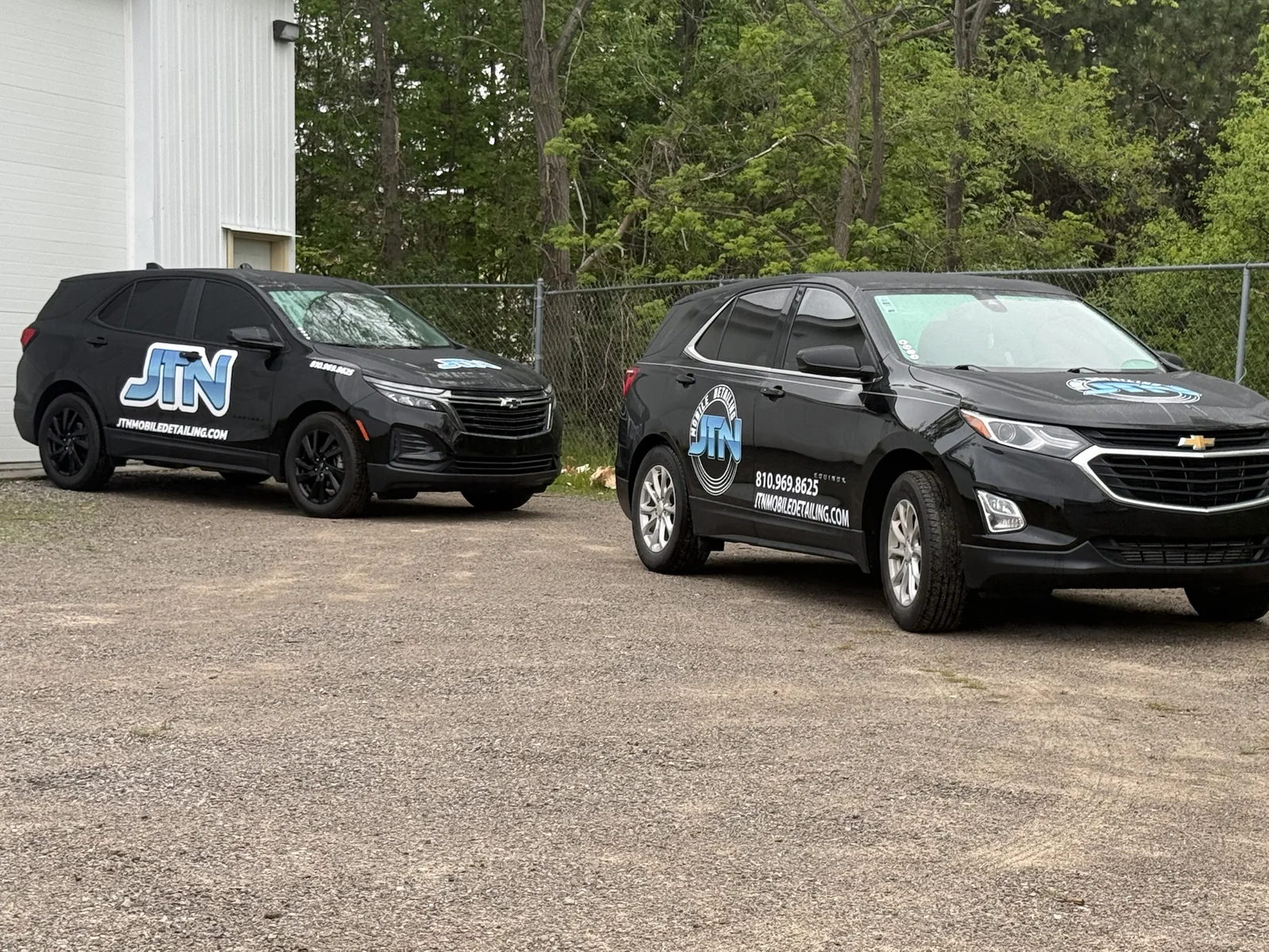 Two JTN Mobile Detailing branded Chevy Equinox mobile units