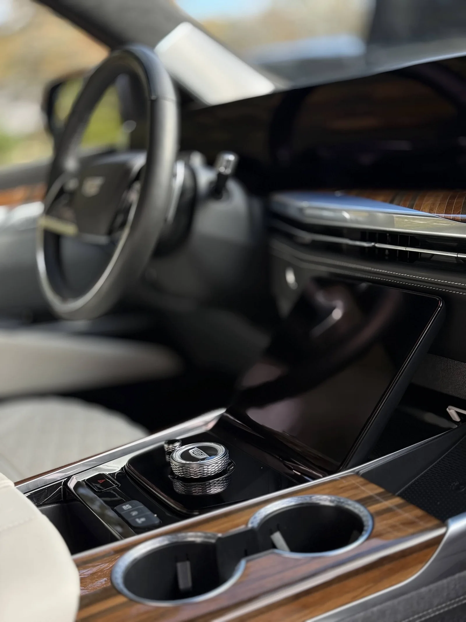 Cadillac center console, wood trim and cup holders after interior detailing