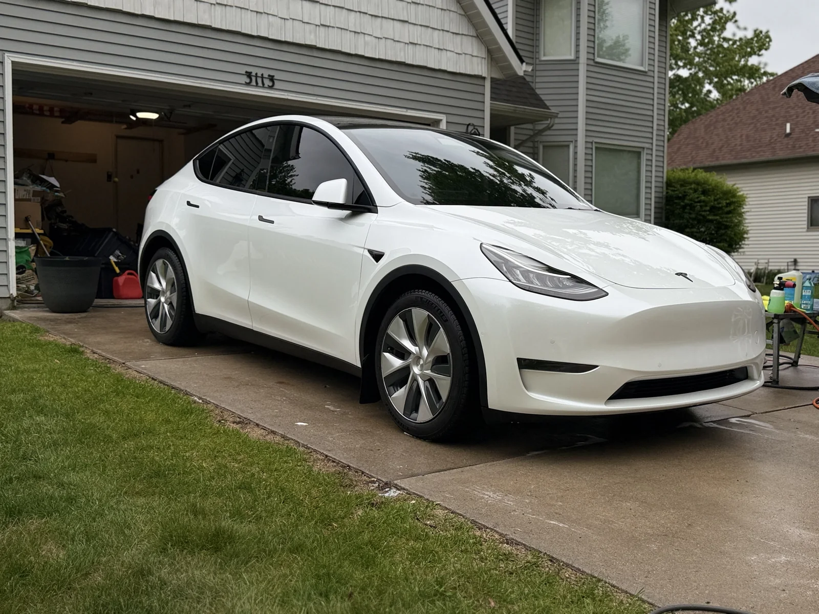 White Tesla Model Y after a driveway mobile detail